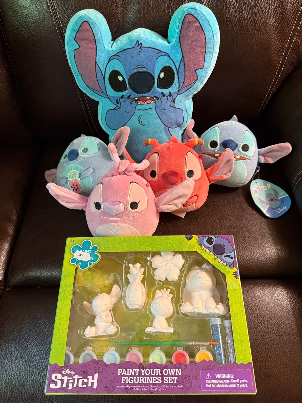 Bundle of Stitch items.  4 squishamals 2 with tags and a figurine paint kit.